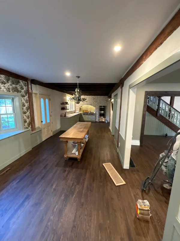 Freshly applied dark wood stain showing rich color and deep grain protection