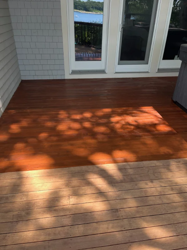 Old damaged deck wood peeling next to a freshly sanded and restored wood section